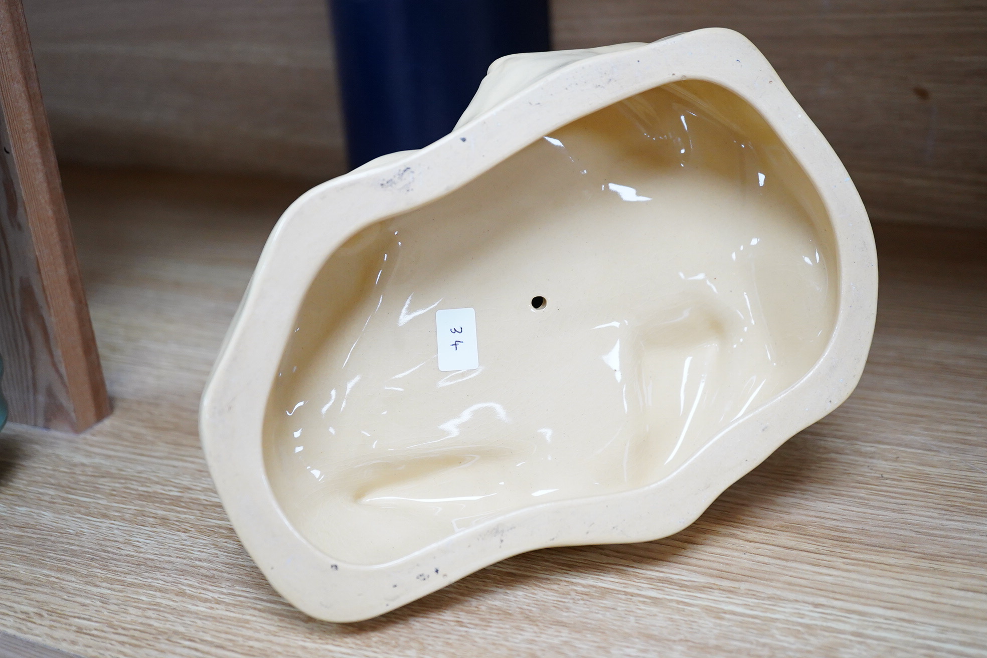 John Skeaping for Wedgwood, an Art Deco seal, straw glazed, 21cm wide